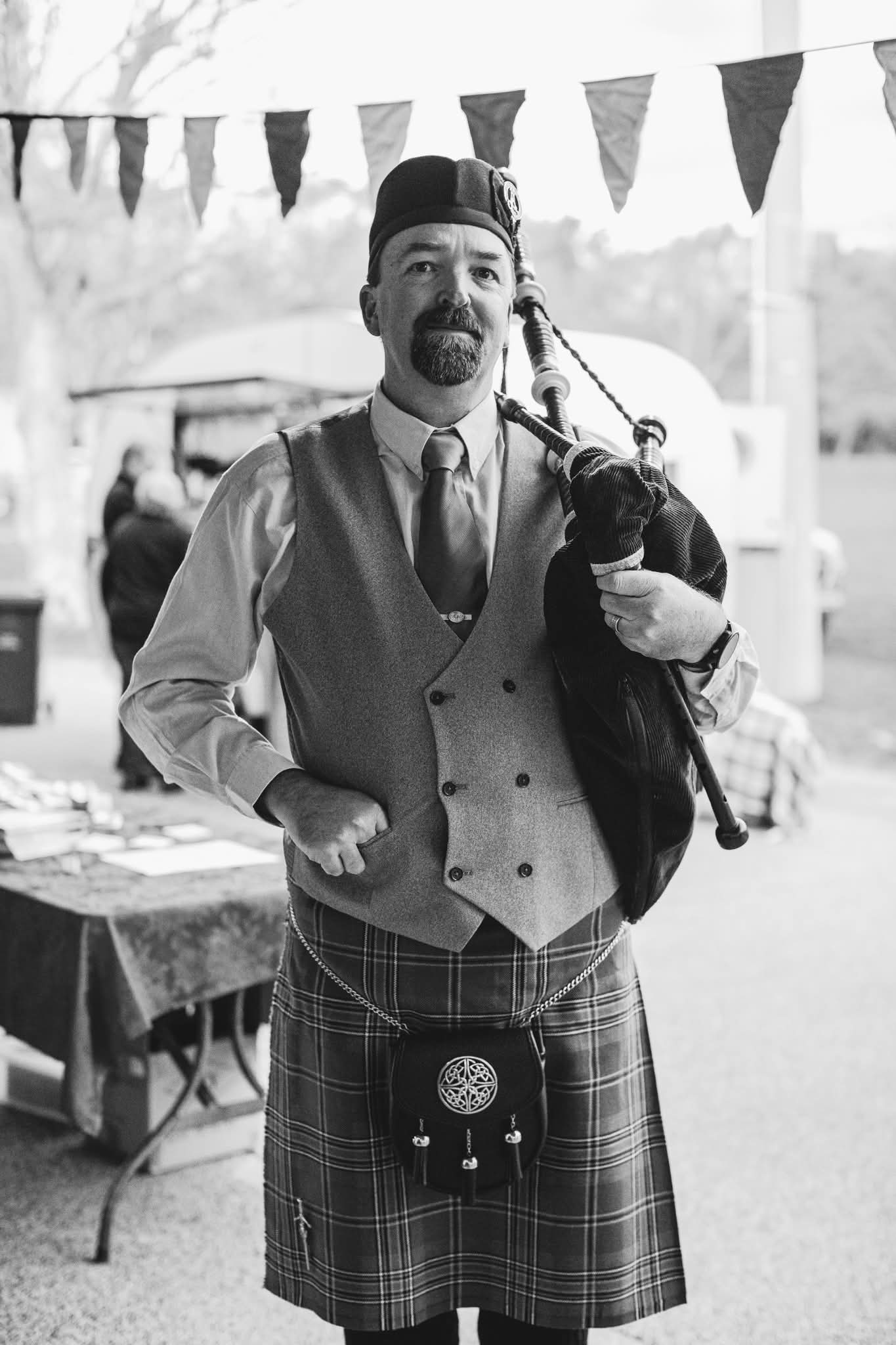 Angus Beath playing bagpipes at a wedding